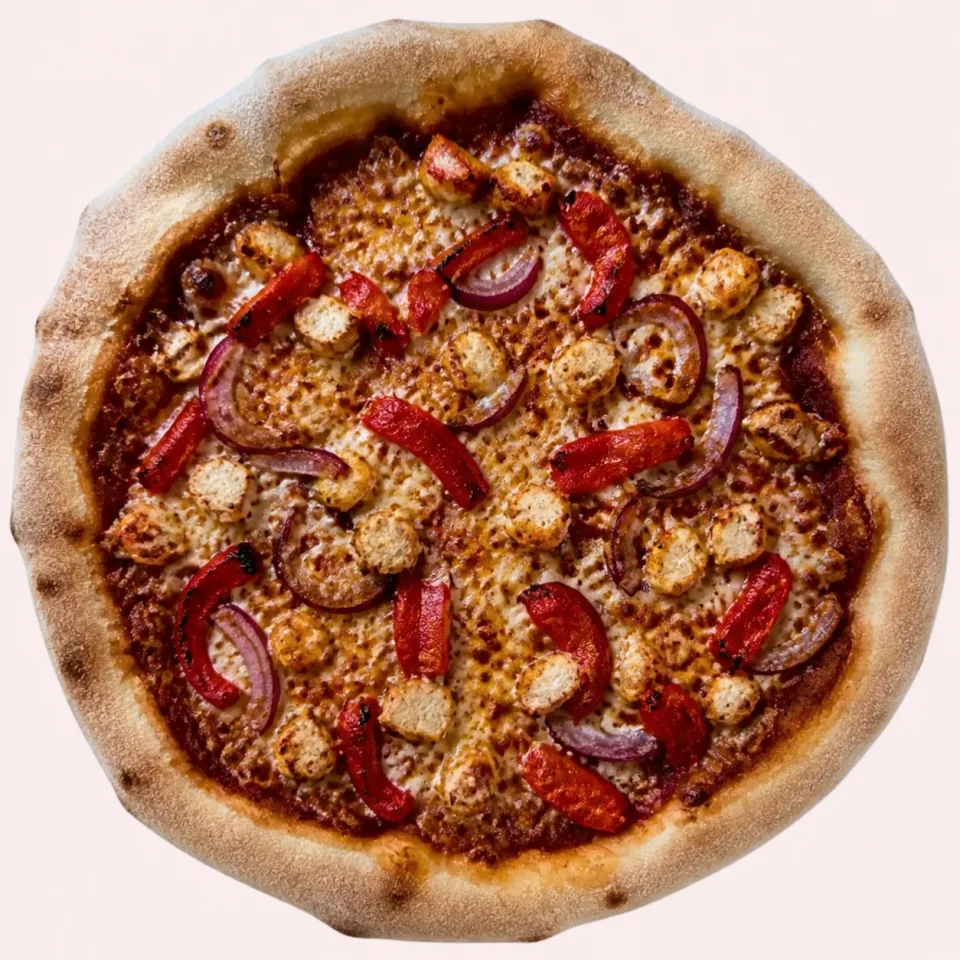 Stone-baked BBQ chicken pizza with roasted peppers and red onion